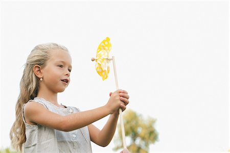 Little girl holding pinwheel Stock Photo - Premium Royalty-Free, Code: 632-05845192