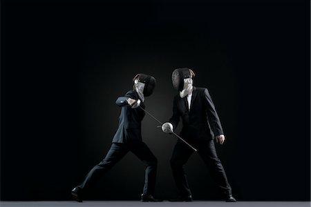 Businessmen fencing Stock Photo - Premium Royalty-Free, Code: 632-05845274