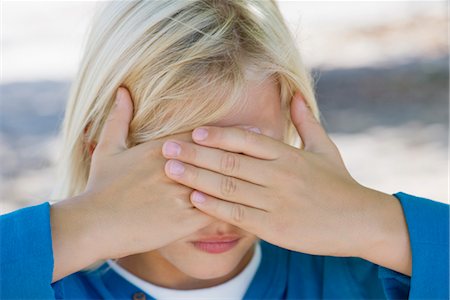 embarrassing - Boy with hands covering eyes Stock Photo - Premium Royalty-Free, Code: 632-05845347