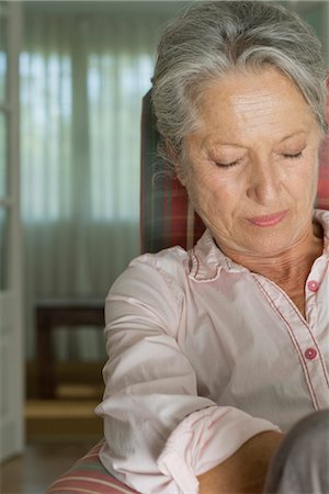 senior woman only - Senior woman napping in armchair Stock Photo - Premium Royalty-Free, Code: 632-05845374