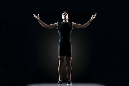 simsearch:632-05992151,k - Male athlete with arms outstretched, portrait Stock Photo - Premium Royalty-Free, Code: 632-05845475