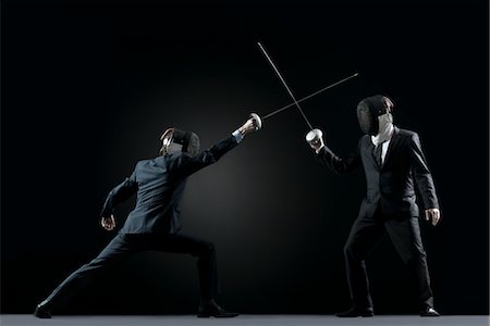 person lunge - Businessmen fencing Stock Photo - Premium Royalty-Free, Code: 632-05845610