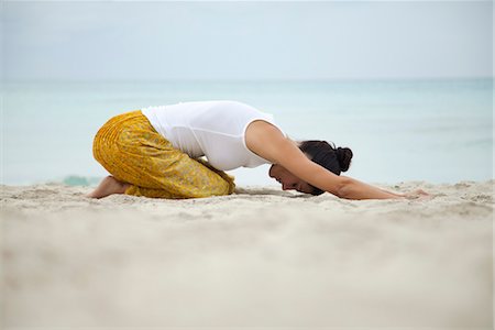 full body mature people profile - Woman in childs pose on beach, side view Stock Photo - Premium Royalty-Free, Code: 632-05991204