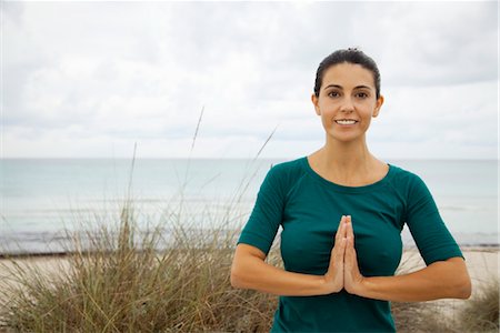 Mature woman practicing yoga on beach, portrait Stock Photo - Premium Royalty-Free, Code: 632-05991226