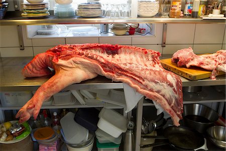 Pork cut on commercial kitchen counter Stock Photo - Premium Royalty-Free, Code: 632-05991368