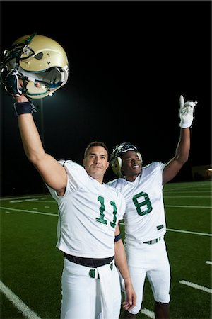 person holding up sign - Football players celebrating victory Stock Photo - Premium Royalty-Free, Code: 632-05991394