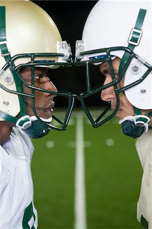 simsearch:632-05992143,k - Opposing football players facing off Stock Photo - Premium Royalty-Free, Code: 632-05991548