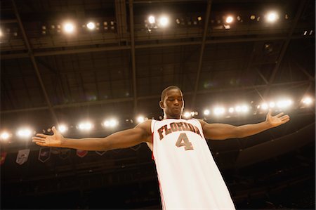 simsearch:632-05991962,k - Basketball player standing with arms out, low angle view Stock Photo - Premium Royalty-Free, Code: 632-05991660