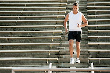 stepping - Man running down stadium steps Stock Photo - Premium Royalty-Free, Code: 632-05991670