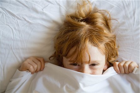 shy children - Boy covering face with bed sheet, directly above Stock Photo - Premium Royalty-Free, Code: 632-05991693