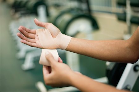 simsearch:632-06118662,k - Woman wrapping hand with bandage, cropped Stock Photo - Premium Royalty-Free, Code: 632-05991851