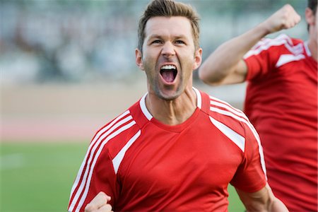 Soccer player cheering Stock Photo - Premium Royalty-Free, Code: 632-05992077