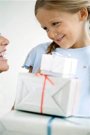 elementary age 2012 - Girl giving her mother gifts Stock Photo - Premium Royalty-Free, Code: 632-05992130