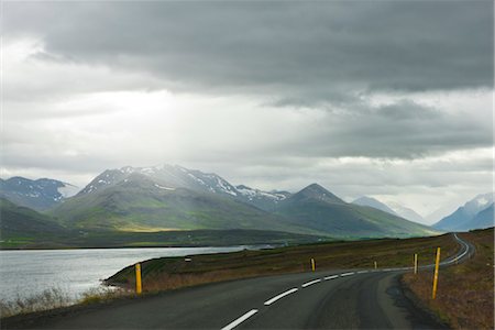 european autobahn - Iceland, road through tranquil countryside with mountains in background Stock Photo - Premium Royalty-Free, Code: 632-06029419