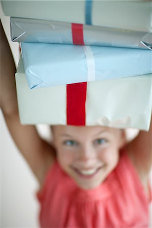 simsearch:614-05819070,k - Girl holding stack of gifts on head Stock Photo - Premium Royalty-Free, Code: 632-06029560