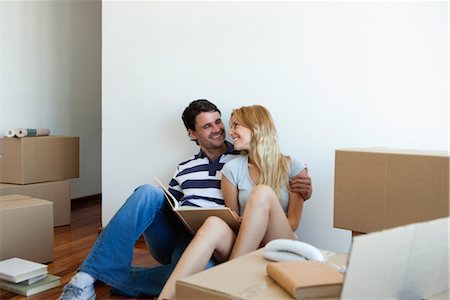 footwear - Couple unpacking cardboard boxes in new house Stock Photo - Premium Royalty-Free, Code: 632-06029681