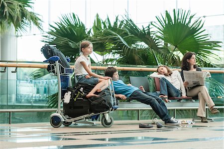 parent child holiday indoors - Family waiting in airport terminal Stock Photo - Premium Royalty-Free, Code: 632-06029699