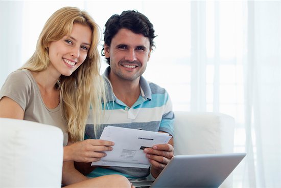 Couple paying bill online Stock Photo - Premium Royalty-Free, Image code: 632-06029691