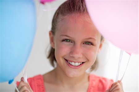 simsearch:695-05763215,k - Girl holding balloons, portrait Stock Photo - Premium Royalty-Free, Code: 632-06029711