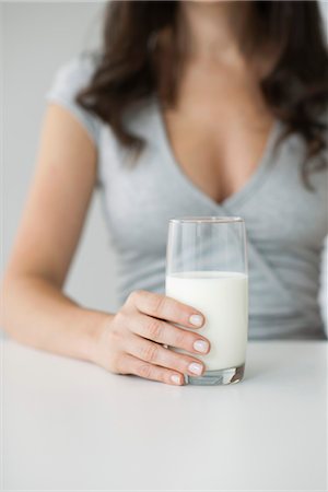 Woman holding glass of milk Stock Photo - Premium Royalty-Free, Code: 632-06029795