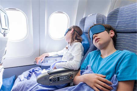 sleeping by the window - Children sleeping on airplane Stock Photo - Premium Royalty-Free, Code: 632-06029824