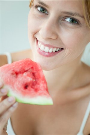 simsearch:632-06029502,k - Young woman holding slice of watermelon, portrait Stock Photo - Premium Royalty-Free, Code: 632-06029873