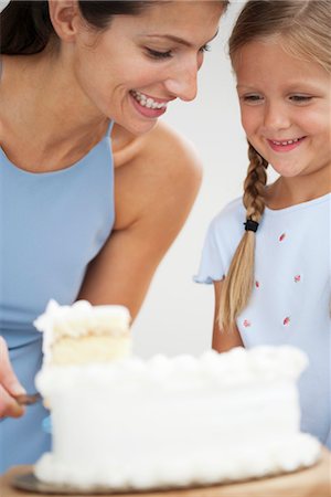 someone cutting cake - Mother and daughter cutting cake Stock Photo - Premium Royalty-Free, Code: 632-06029939