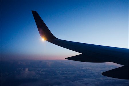 plane light - Wing of airplane in flight at dusk Stock Photo - Premium Royalty-Free, Code: 632-06029960