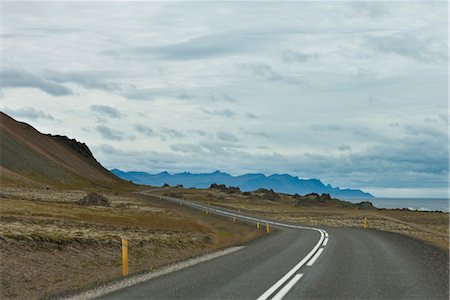 scenic windy road - Road winding through mountain landscape, Iceland Stock Photo - Premium Royalty-Free, Code: 632-06030176