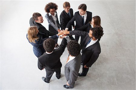 Business team members link hands in unity Stock Photo - Premium Royalty-Free, Code: 632-06118108