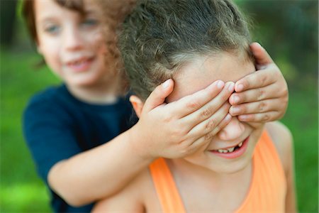 Boy covering girl's eyes Stock Photo - Premium Royalty-Free, Code: 632-06118154