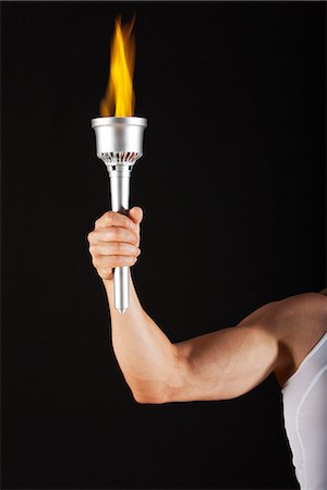 strong hand - Man holding torch, cropped Stock Photo - Premium Royalty-Free, Code: 632-06118189