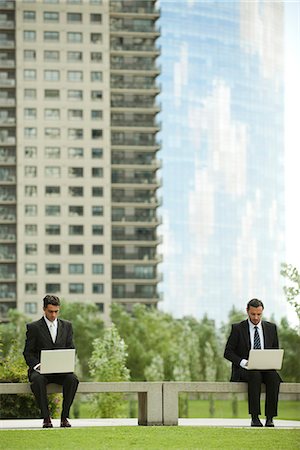 picture of two people on a park bench - Businessmen using laptop computers outdoors Stock Photo - Premium Royalty-Free, Code: 632-06118322