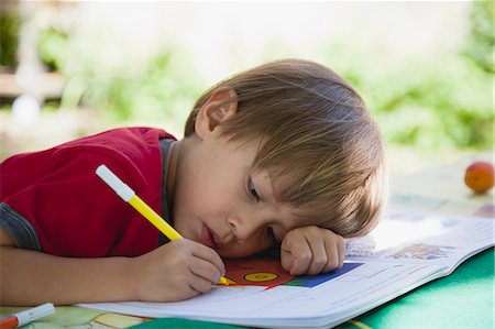 Boy coloring with markers Stock Photo - Premium Royalty-Free, Code: 632-06118356