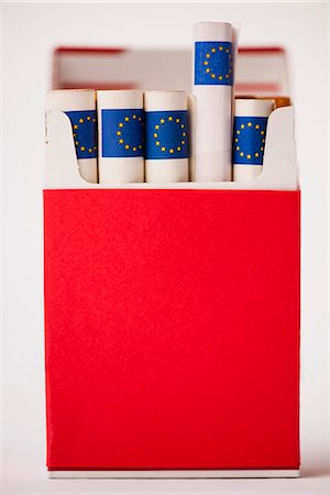 euro photography - Cigarette pack containing rolled euros Stock Photo - Premium Royalty-Free, Code: 632-06118408