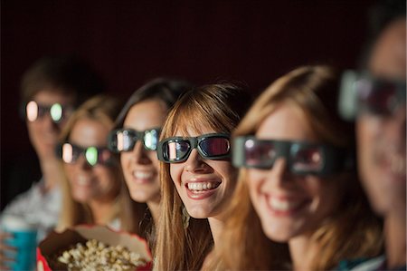 people in the movie theater line - Audience wearing 3-D glasses in movie theater Stock Photo - Premium Royalty-Free, Code: 632-06118544