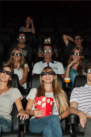 entertainment and movie - Audience wearing 3-D glasses in movie theater Foto de stock - Sin royalties Premium, Código: 632-06118578