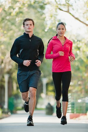 persona que trota - Young couple jogging side by side Foto de stock - Sin royalties Premium, Código: 632-06118631