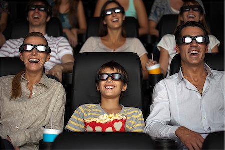 family watching film in movie theater - Family watching 3-D movie in theater Stock Photo - Premium Royalty-Free, Code: 632-06118660