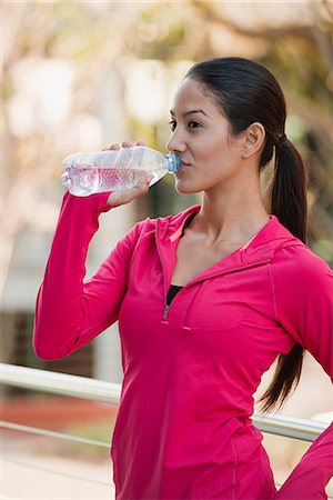 drinking water bottle - Young woman drinking bottle of water Stock Photo - Premium Royalty-Free, Code: 632-06118713