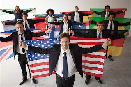 people holding up american flags - Nations vie for shares of global business Stock Photo - Premium Royalty-Free, Code: 632-06118932