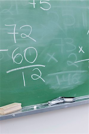 Handgun resting on blackboard in classroom Stock Photo - Premium Royalty-Free, Code: 632-06317263