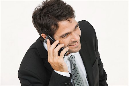 simsearch:695-03380514,k - Businessman talking on cell phone Fotografie stock - Premium Royalty-Free, Codice: 632-06317275