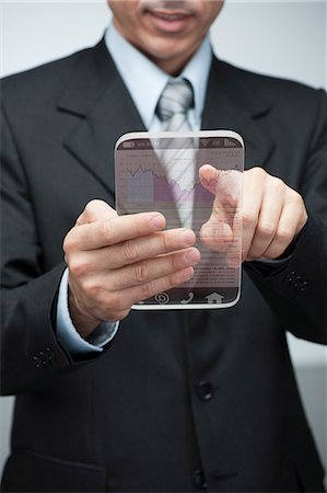 Geschäftsmann mit advanced digital Tablet auf Zugangsdaten Börse abgeschnitten Stockbilder - Premium RF Lizenzfrei, Bildnummer: 632-06317295