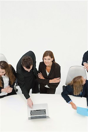 Businesswoman collaborating with colleague in meeting Stock Photo - Premium Royalty-Free, Code: 632-06317301