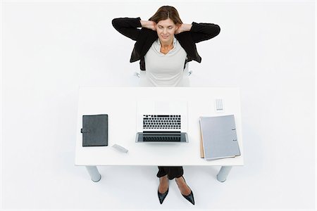 Businesswoman relaxing at desk with eyes closed Stock Photo - Premium Royalty-Free, Code: 632-06317319