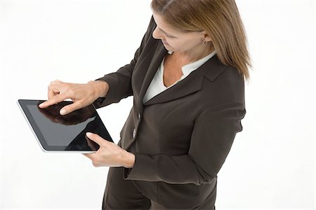 facile - Businesswoman using digital tablet Foto de stock - Sin royalties Premium, Código: 632-06317327