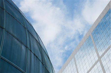 Facade of high rises against sky, low angle view Stock Photo - Premium Royalty-Free, Code: 632-06317413