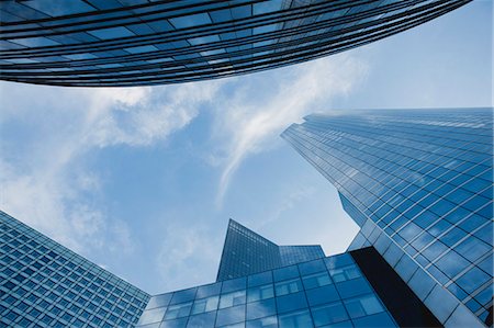 Facade of modern office buildings against sky, directly below Stock Photo - Premium Royalty-Free, Code: 632-06317429