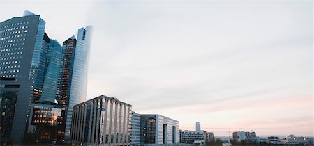 simsearch:632-06317300,k - Toits de la ville sur fond de ciel de couleur pastel, vue panoramique Photographie de stock - Premium Libres de Droits, Code: 632-06317447